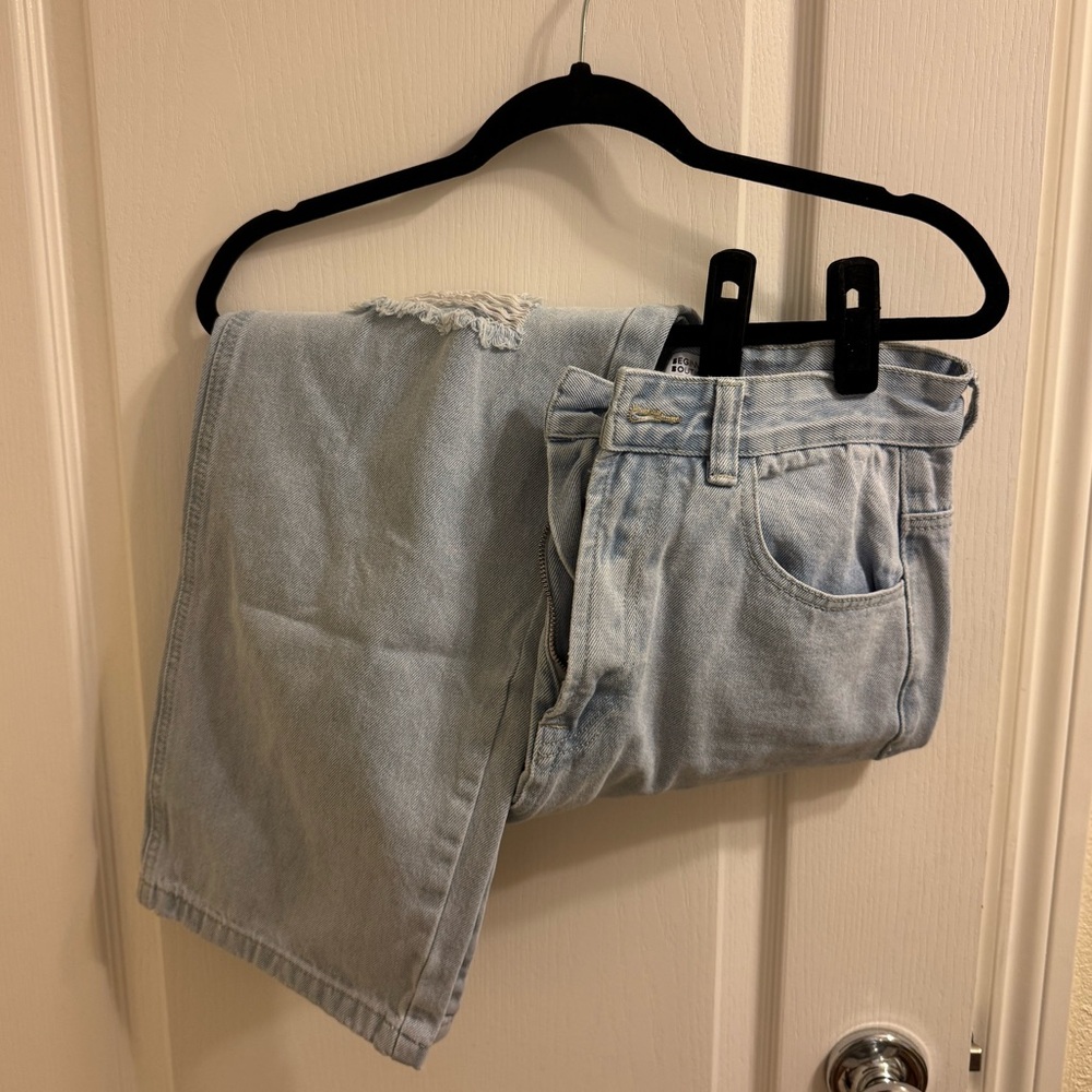 light wash high waisted jeans with holes in the knees